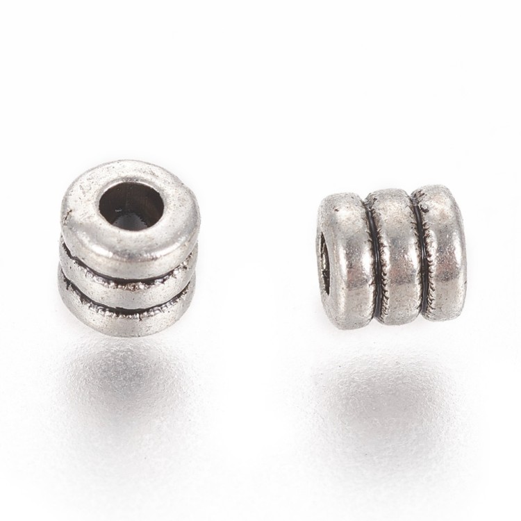 PRM649 Przekładka metalowa ozdobna walec 4x3,9mm 10szt stare srebro