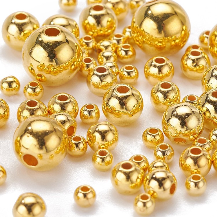 ZKOR53 Zestaw koraliki przekładki plastikowe powlekane CCB 497szt złote