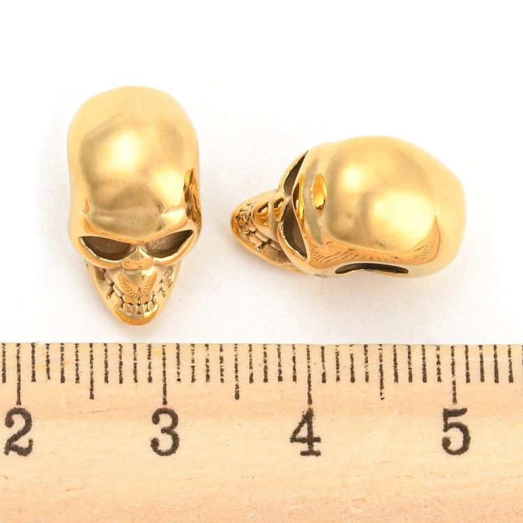 PRM663 Przekładka metalowa czaszka 9x16x13mm stal nierdzewna IP złota