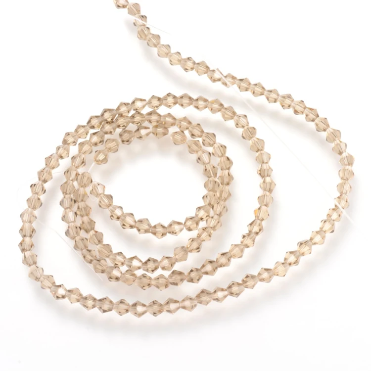 BIC206 Koraliki szklane szlifowane bicone 6mm kryształki sznur 45szt j.brzoskwiniowe