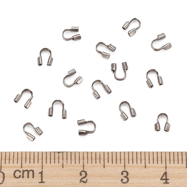KRZ135 Zakończenia ochronne linki 0,7mm podkówki 4x4,5mm 20szt z mosiądzu grafitowe