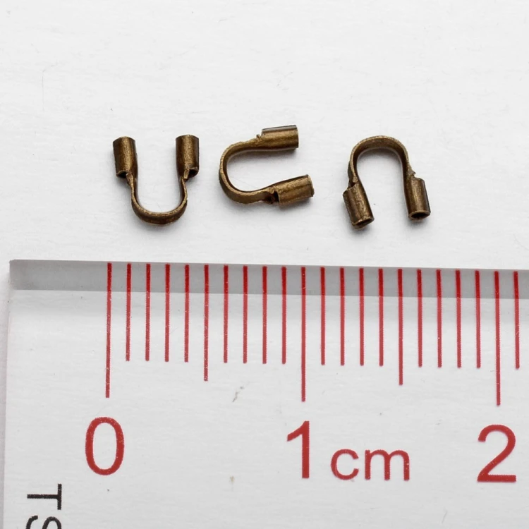 KRZ136 Zakończenia ochronne linki 0,5mm podkówki z mosiądzu 4x4,5mm 20szt mosiężne