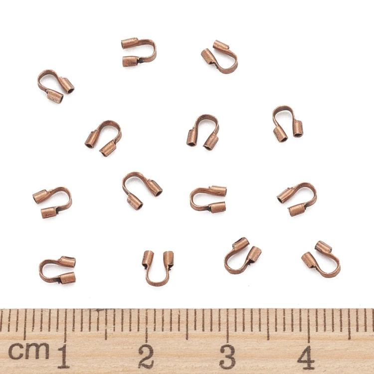 KRZ136 Zakończenia ochronne linki 0,5mm podkówki z mosiądzu 4x4,5mm 20szt miedziane