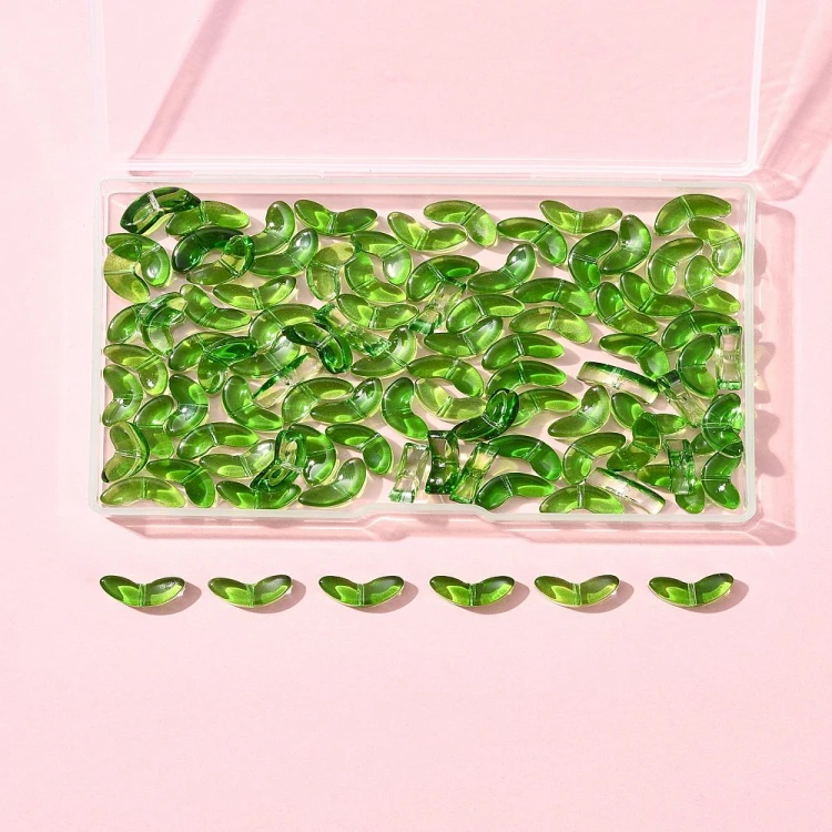 KS142 Koraliki szklane listki 14x6,5mm 100szt transparentne zielone